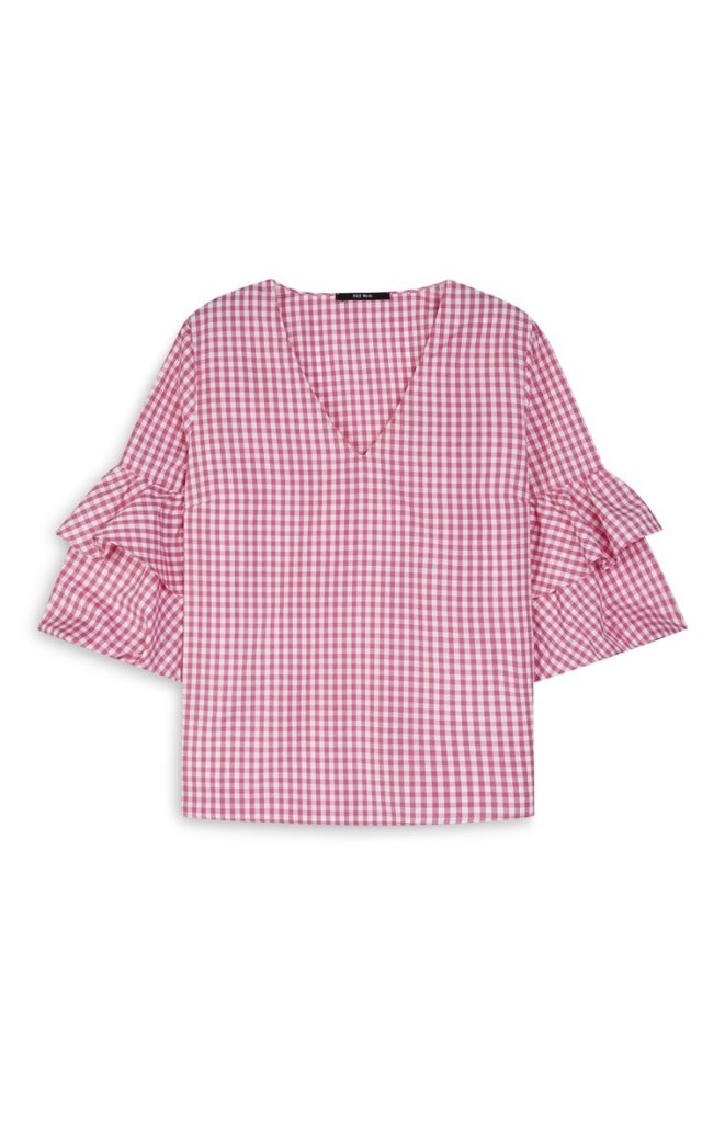 Blusa rosa con mangas acampanadas y nudo